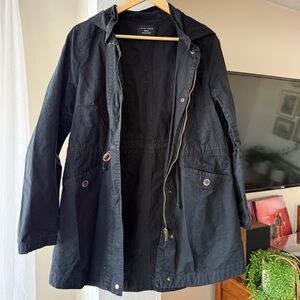 Woman’s hooded black utility jacket